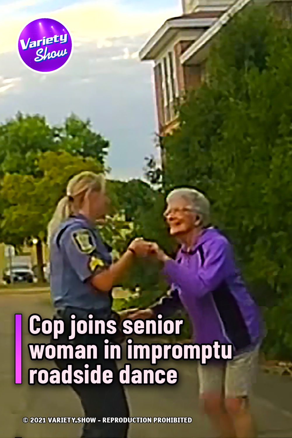 Cop joins senior woman in impromptu roadside dance